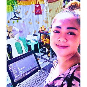 “Lalaine Oppura attending another day of her virtual assistant course, focused and learning from her laptop”